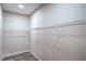 Walk-in closet with white shelving at 7772 Buckwood Ct, Las Vegas, NV 89149