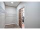 Walk-in closet with shelving and decorative sliding doors leading to ensuite bathroom at 7772 Buckwood Ct, Las Vegas, NV 89149