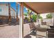 Relaxing covered patio with outdoor seating in the low-maintenance backyard at 7820 Esteem St, Las Vegas, NV 89131