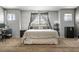 Bright bedroom with large windows, exposed brick, neutral walls, and ample space at 7820 Esteem St, Las Vegas, NV 89131