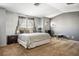 Bright bedroom with large windows, exposed brick, neutral walls, and ample space at 7820 Esteem St, Las Vegas, NV 89131