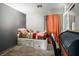 Bedroom with a single bed, drawers for storage, and an antique desk at 7820 Esteem St, Las Vegas, NV 89131
