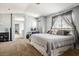 Bright bedroom with large windows, exposed brick, neutral walls, and ample space at 7820 Esteem St, Las Vegas, NV 89131