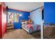 bedroom featuring brightly painted walls and matching decor at 7820 Esteem St, Las Vegas, NV 89131