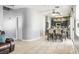 Open concept dining area flowing into kitchen featuring tile floors and sliding glass doors at 7820 Esteem St, Las Vegas, NV 89131