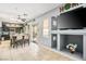Inviting dining area with view into the kitchen, featuring modern lighting and gray walls at 7820 Esteem St, Las Vegas, NV 89131