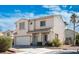 Charming two-story stucco home featuring a two-car garage and beautifully landscaped front yard at 7820 Esteem St, Las Vegas, NV 89131