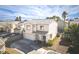 Two-story home featuring a two-car garage, desert landscaping, and a tile roof at 7820 Esteem St, Las Vegas, NV 89131
