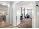 Hallway featuring light vinyl flooring, gray walls and white trim at 7820 Esteem St, Las Vegas, NV 89131