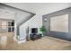 This spacious living room features neutral tile flooring and a modern entertainment center at 7820 Esteem St, Las Vegas, NV 89131