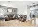 Welcoming living area featuring neutral tile, comfortable seating, and bright, airy ambiance at 7820 Esteem St, Las Vegas, NV 89131
