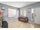 Inviting Living Room with tile floors, neutral paint and large windows at 7820 Esteem St, Las Vegas, NV 89131