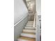 An interior staircase of the home featuring gray walls and white trim at 7820 Esteem St, Las Vegas, NV 89131