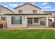 Wide backyard featuring a neatly kept lawn, covered patio, and exterior view at 9947 Fletcher Peak Ave, Las Vegas, NV 89178