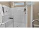 This modern bathroom features a sleek glass-enclosed shower with built-in bench and shelving at 9947 Fletcher Peak Ave, Las Vegas, NV 89178