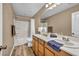 Clean and modern bathroom with a single vanity and shower-tub combo at 9947 Fletcher Peak Ave, Las Vegas, NV 89178