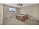 Comfortable bedroom with neutral tones, soft carpet and a view of the landscape at 9947 Fletcher Peak Ave, Las Vegas, NV 89178