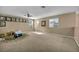 A spacious bonus room with carpet, ample lighting, and lots of possibilities at 9947 Fletcher Peak Ave, Las Vegas, NV 89178