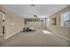 Spacious bonus room with neutral carpet, ceiling fan, and natural light at 9947 Fletcher Peak Ave, Las Vegas, NV 89178