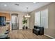 Dining area with a pendant light, plants, and window at 9947 Fletcher Peak Ave, Las Vegas, NV 89178