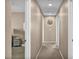 Hallway with neutral walls and carpeted floor, showcasing the house's interior design at 9947 Fletcher Peak Ave, Las Vegas, NV 89178