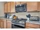 This kitchen has a gas range, granite counters, and stainless steel appliances at 9947 Fletcher Peak Ave, Las Vegas, NV 89178