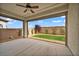 Covered patio overlooking a green lawn with a block wall at 9947 Fletcher Peak Ave, Las Vegas, NV 89178