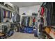 Organized walk-in closet with racks, shelves, and ample storage for clothing and accessories at 9947 Fletcher Peak Ave, Las Vegas, NV 89178