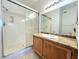 Bathroom with tiled floor, granite countertop, single vanity, and walk-in shower at 1521 Ruby Cliffs Ln # 104, Las Vegas, NV 89144
