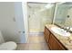 Bathroom with tiled floor, granite countertop, single vanity, and walk-in shower at 1521 Ruby Cliffs Ln # 104, Las Vegas, NV 89144