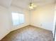 Bedroom featuring carpet floor, ceiling fan, and window at 1521 Ruby Cliffs Ln # 104, Las Vegas, NV 89144