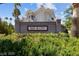 Welcoming entrance to Red Bluffs, featuring a well-maintained sign and lush greenery at 1521 Ruby Cliffs Ln # 104, Las Vegas, NV 89144