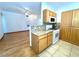 Bright kitchen featuring granite countertops, gas range, and natural wood cabinets at 1521 Ruby Cliffs Ln # 104, Las Vegas, NV 89144