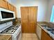 Modern kitchen featuring stainless steel appliances, granite countertops, and sleek cabinetry at 1521 Ruby Cliffs Ln # 104, Las Vegas, NV 89144