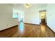 Bright living room boasts pristine walls, wood floors, and a view into the connected kitchen at 1521 Ruby Cliffs Ln # 104, Las Vegas, NV 89144