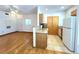 Stylish living area with hardwood floors, featuring a kitchen with granite counters and bright natural light at 1521 Ruby Cliffs Ln # 104, Las Vegas, NV 89144