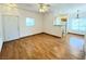 Inviting living room features sleek wood floors and ample natural light from bright windows at 1521 Ruby Cliffs Ln # 104, Las Vegas, NV 89144
