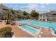 Enjoy a relaxing day at the community pool and spa with ample seating and manicured landscaping at 1521 Ruby Cliffs Ln # 104, Las Vegas, NV 89144