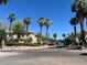 Charming street view showcases lush palm trees and well-maintained residential properties on a bright day at 1521 Ruby Cliffs Ln # 104, Las Vegas, NV 89144