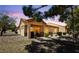 The backyard offers a serene patio area, desert landscaping, and a well-maintained exterior at 1900 Bellview St, Las Vegas, NV 89134