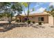 Well-maintained backyard with desert landscaping, a covered patio, perfect for outdoor living at 1900 Bellview St, Las Vegas, NV 89134