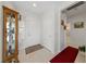 Welcoming foyer features neutral paint, tile flooring, and a display cabinet for showcasing decor at 1900 Bellview St, Las Vegas, NV 89134