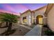 Elegant single-story home featuring a covered entryway, desert landscaping, and neutral exterior paint at 1900 Bellview St, Las Vegas, NV 89134