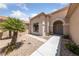 Inviting front entrance featuring a desert landscape, covered entryway and tiled roof at 1900 Bellview St, Las Vegas, NV 89134