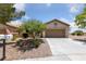 Charming single-story home with a two-car garage and low maintenance desert landscaping at 1900 Bellview St, Las Vegas, NV 89134