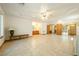 Spacious main bedroom with tile floors, a ceiling fan and backyard access at 2040 Tucuman Ave, Pahrump, NV 89048