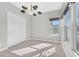Bright bedroom featuring neutral walls, large windows, and sliding-door closet at 2170 Monte Bianco Pl, Henderson, NV 89044