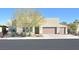 Contemporary single-story home with desert landscaping and a three-car garage at 2170 Monte Bianco Pl, Henderson, NV 89044