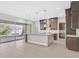 Kitchen boasts a large island, stainless steel appliances, and abundant natural light from sliding doors at 2170 Monte Bianco Pl, Henderson, NV 89044