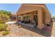 Inviting backyard with covered patio and lush landscaping; ideal for outdoor living at 2398 Jada Dr, Henderson, NV 89044